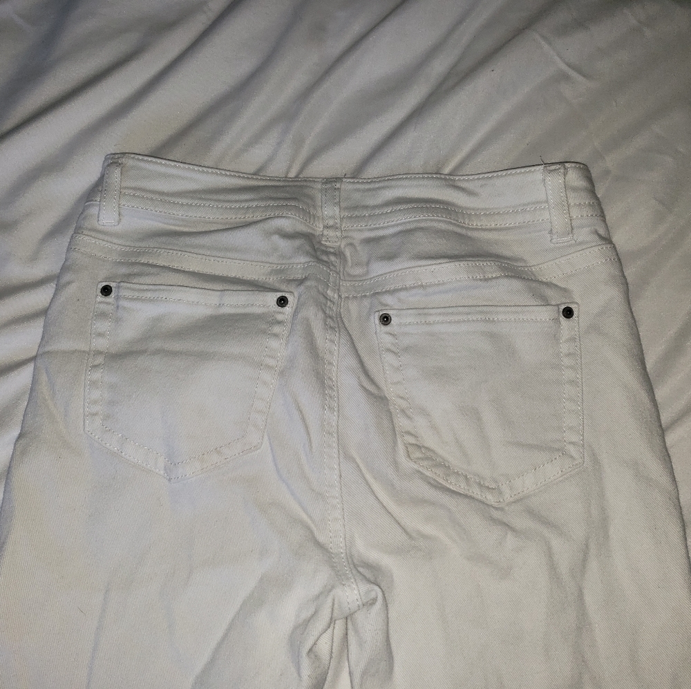 white ripped pants